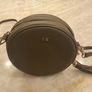 Round Michael Kors crossbody.  Excellent condition. Worn only once. EUC